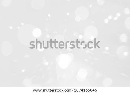 White and silver blur abstract background with bokeh lights for background and wallpaper Christmas. Royalty-Free Stock Photo #1894165846