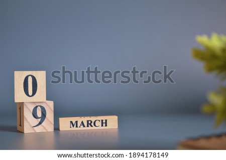 March 9, Cover in the evening time, Date Design with number cube for a background.