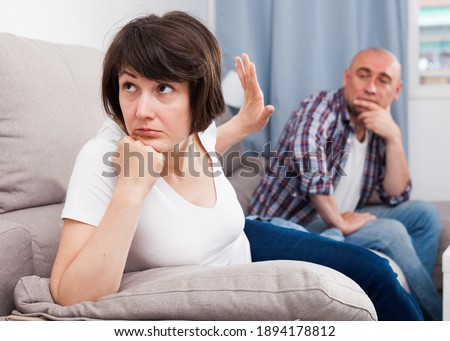 Quarrel between husband and wife in the apartment. High quality photo Royalty-Free Stock Photo #1894178812