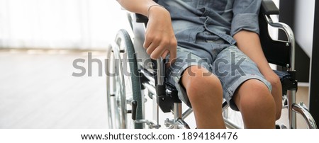 Disability polio patient sitting on wheelchair in hospital, Banner with copy space Royalty-Free Stock Photo #1894184476