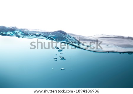 Blurred beautiful swaying water waves splashing water waves in clean blue water.