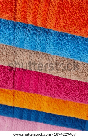 Colorful towels stack close-up detail