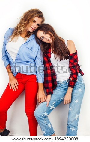 best friends teenage girls together having fun, posing emotional on white background, besties happy smiling, lifestyle people concept, blond and brunette multi nations