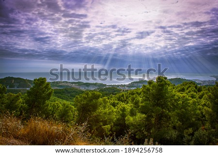 sunset over the mountains with sun rays
