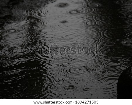 Close up of water puddle in the rainy day