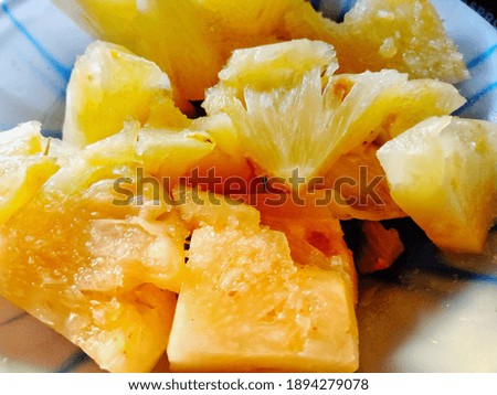 pineapple sliced ​​and then served and mixed with sugar