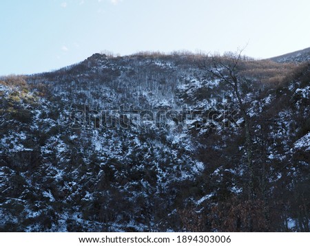 Mountain landscape with snow and blue sky in El Bierzo     
