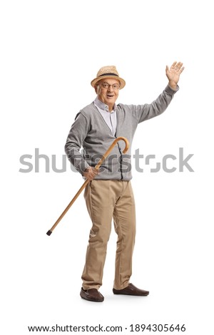 Elderly man holding a cane and waving isolated on white background Royalty-Free Stock Photo #1894305646