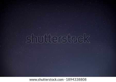 Winter time stars with mountains and houses
