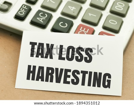 Text TAX LOSS HARVESTING written on white paper note on calculator.Business concept.