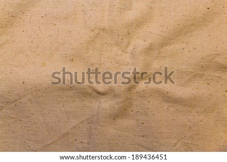 texture of the old, yellowed and crumpled canvas