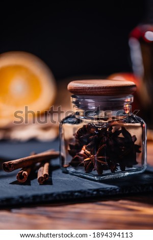 Still life - spices star anise and cinnamon among fruits. Scented cozy Christmas celebration, fragrant punch concept. High quality 4k footage