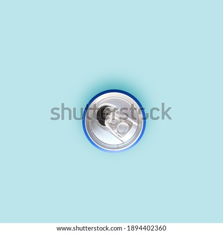 photo of the empty can from above. with a dark blue background. top view