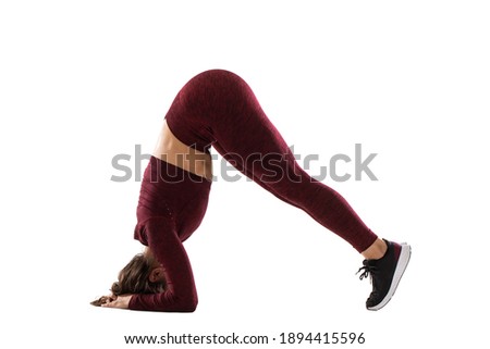 woman with perfect body is doing stretching exercise, sporty young woman doing stretching lunge exercise isolated
