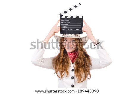 Young   cowgirl  with movie board isolated on white