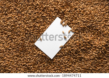 Blank business card mockup on the malts seeds background, craft beer mockup templates, with empty space to place your label or design