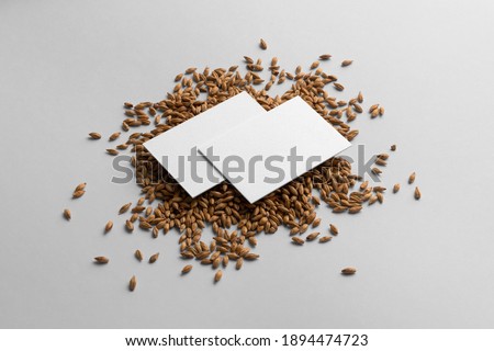 Blank business cards mockups with malts seeds on a white background, craft beer mockup templates, with empty space to place your label or design