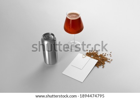 Blank beer can, glass with beer. cards and malts on a white background, craft beer mockup templates, with empty space to place your label or design