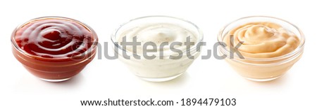 Set of sauces - barbecue, garlic and burger sauce in glass bowl isolated on white background Royalty-Free Stock Photo #1894479103