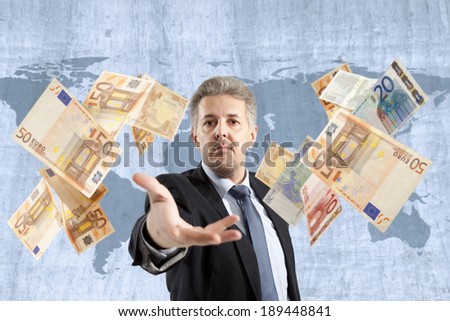 Handsome adult businessman throwing euro