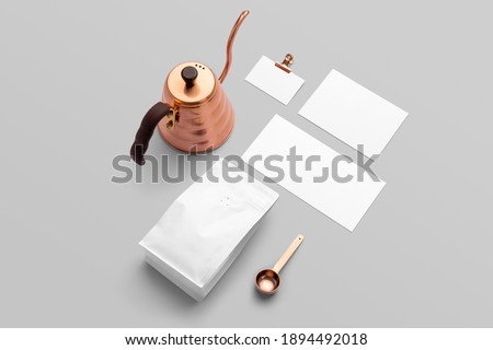 Blank coffee packaging with different white cards, copper spoon and pot coffee packaging mockup with empty space to display your branding design.