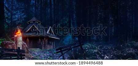 Horror background image of fantasy witch house in night  woods with magic totem with symbols.