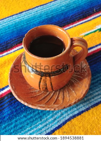 MEXICAN COFFEE IN TYPICAL CLAY CUP, MEXICO, TEOTIHUCAN Royalty-Free Stock Photo #1894538881