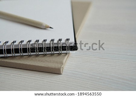 Empty spiral notebook and pencil, sketch book close up, feminine styled stock photo for blog post, empty space for text, writing, art, design concept.   