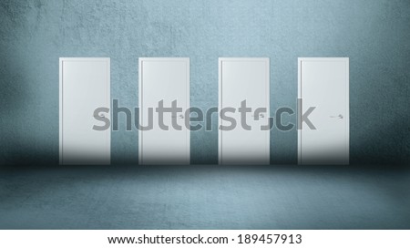 Four white closed doors on gray background Royalty-Free Stock Photo #189457913