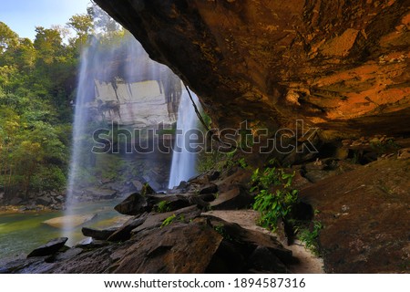 Huay Luang Waterfall surrounded by the rich forests with streams flowing from a high cliff into a large pond below ,Phu Chong Na Yoi National Park ,Thailand 