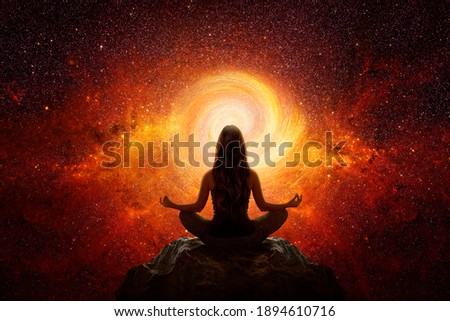 Woman with yoga pose in front of the universe Royalty-Free Stock Photo #1894610716