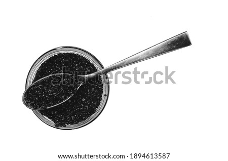 Black halibut caviar in a round jar and spoon top view isolated on a white background.