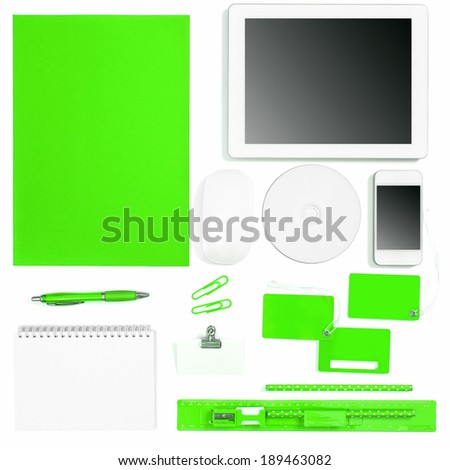 Set of green colored office tools over white background. Corporate identity objects