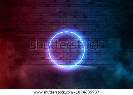 Blue neon circle on the brick wall on smoke. Bright banner advertising with  copy space.