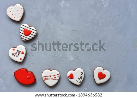 Valentine's day Homemade cookies on Ultimate Gray background, top view. Space for text. Delicious and sweet, covered with icing with a beautiful pattern gingerbread inscription in Russian - for you