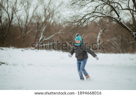 Kid running. Motion Winter activities