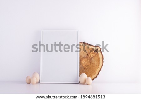Blank white text frame on a white table. interior light style with easter eggs