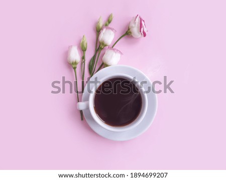 cup of coffee flower rose on a colored background