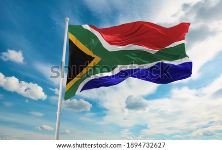 Large South Africa flag waving in the wind Royalty-Free Stock Photo #1894732627