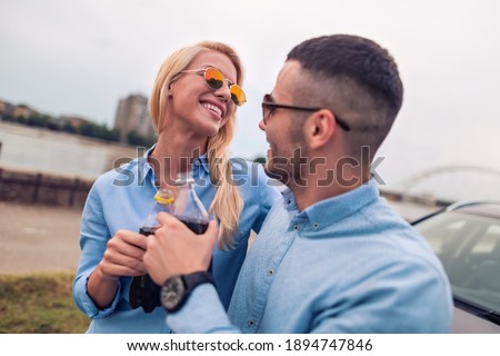 Smiling couple in love outdoors,enjoying together.