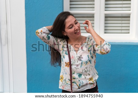 Woman with a smile on the street