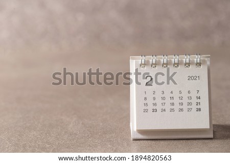 February 2021 calendar on gray background