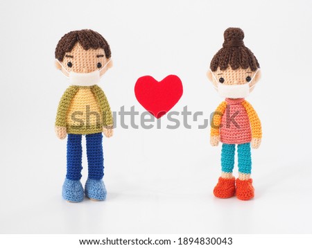 Small and cute Amigurumi doll on white background