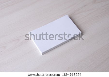Business card blank on wooden background. Corporate Stationery, Branding Mock-up. Creative designer desk. Flat lay. Copy space for text. Template for ID