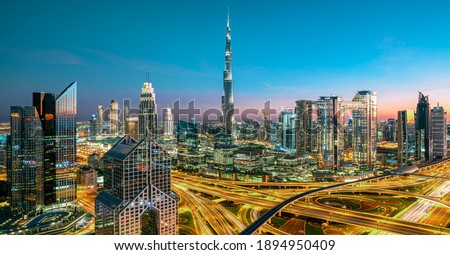 Dubai city center and Sheikh Zayed bussy intersection before  sunset with colorful sky, United Arab Emirates
