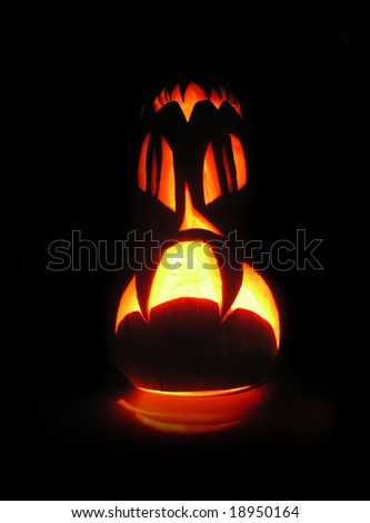 pumpkin with eyes on a black background