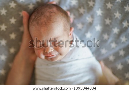 Joy of motherhood. Cute newborn baby in mother's arms. Royalty-Free Stock Photo #1895044834
