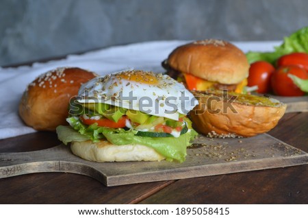 Close-up of home made burgers on wooden table
