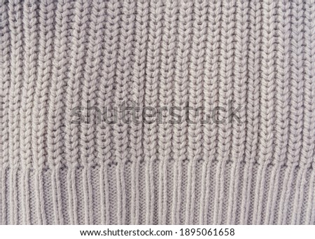 gray knit sweater close up, cozy textures, winter fashion