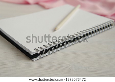 Empty spiral notebook and pencil, sketch book close up, feminine styled stock photo for blog post, writing, art concept.	  